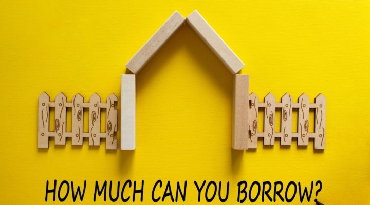wooden house with how much can i borrow written underneath
