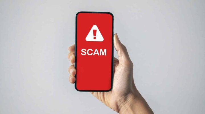 Mobile phone displaying scam text