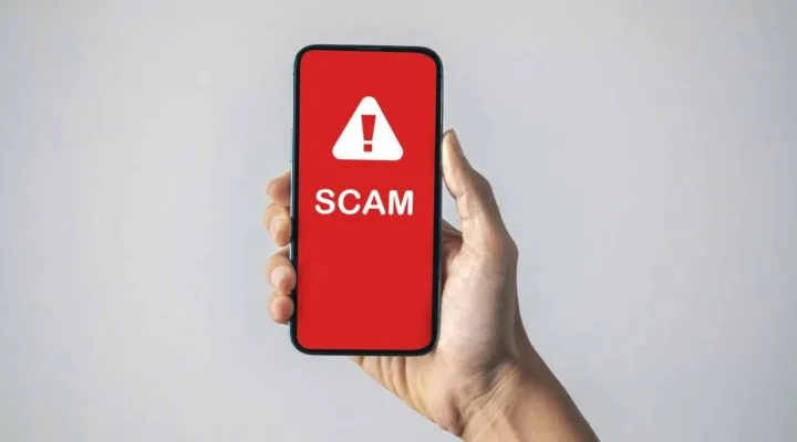 Mobile phone displaying scam text