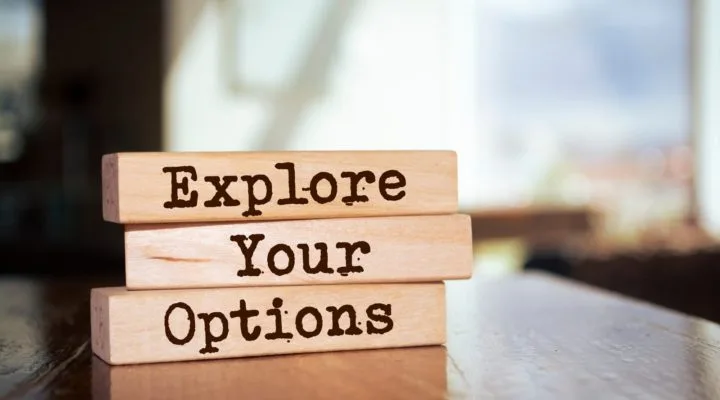 Explore you options written on wooden blocks